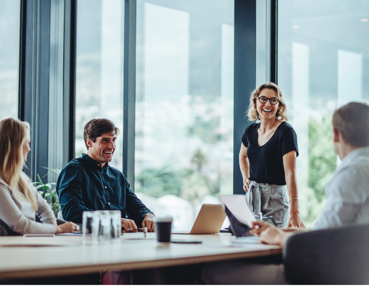 A group of people in a meeting room 