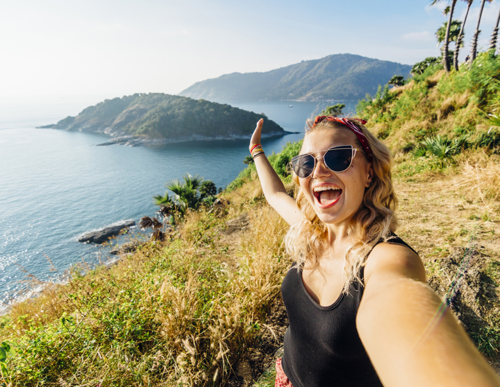 Women on holiday taking a selfie on a mountain