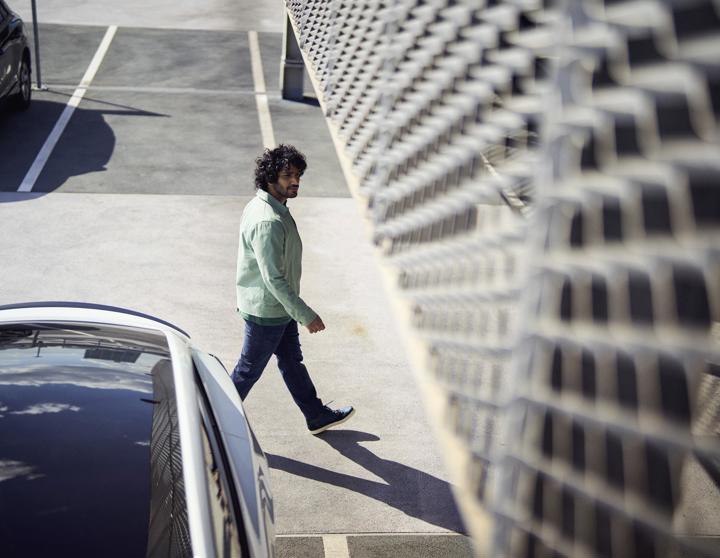 Man in free-flow parking lot