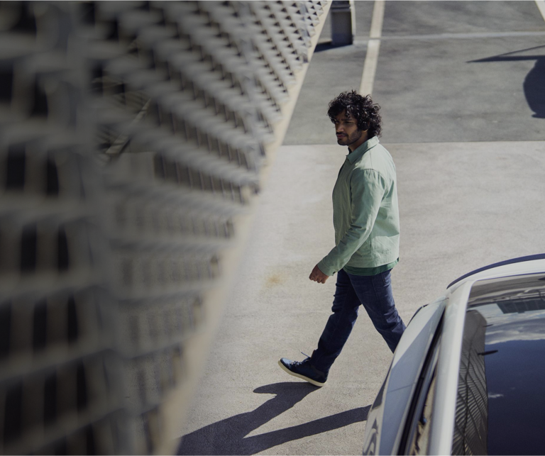 Man walking in free-flow parking lot