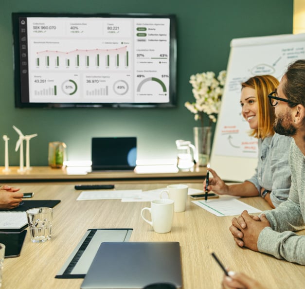 A group of people in a business meeting