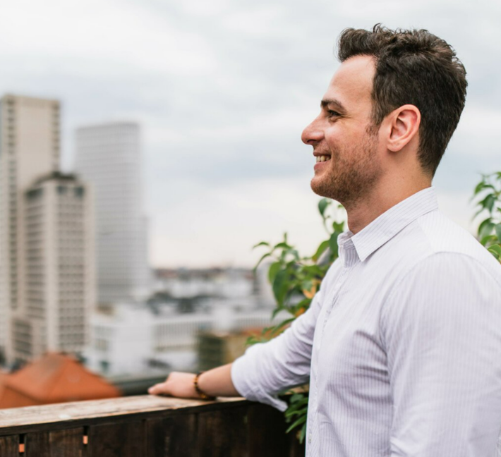 young man standing on a rooftop in Berlin