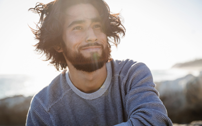 man at the beach facing the camera