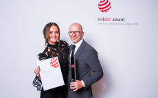 Mareike Hoekman and Florian Haubold of Riverty holding Red Dot Award