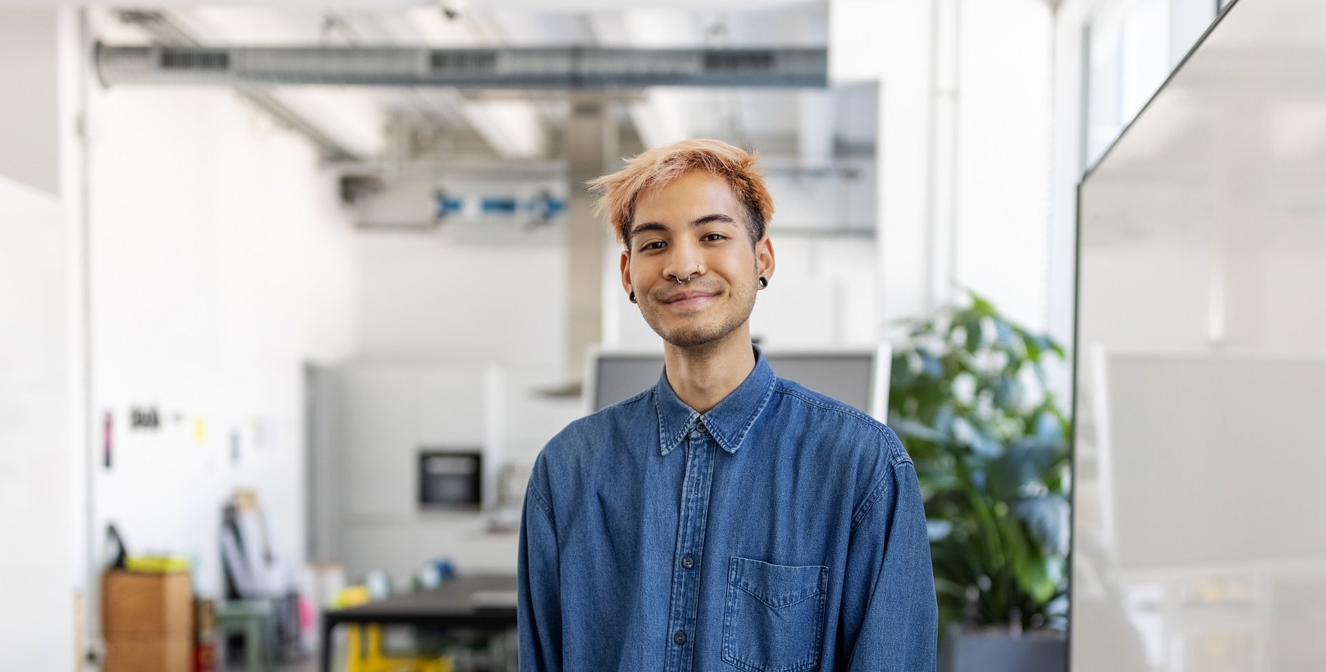 young man smiling into the camera 