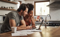 Couple looking at their budget on a computer screen