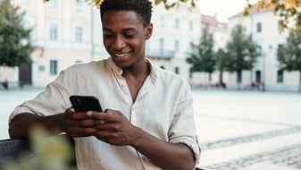 Person looking at their budget on a phone screen