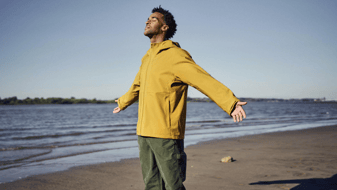 man next to the ocean 