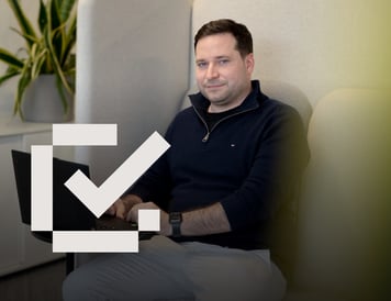 Checklist item marked as complete. Employee sitting comfortably in a private office booth while working on a laptop. The quiet workspace and modern office surroundings reflect a flexible environment designed to support focused work and productivity.