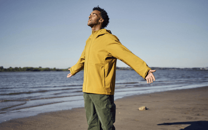 man next to the ocean