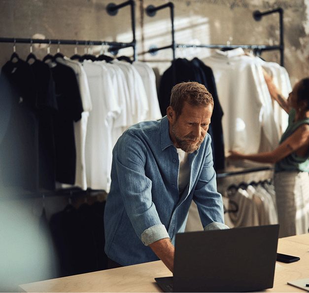 Woman finalizing orders and checking her phone.