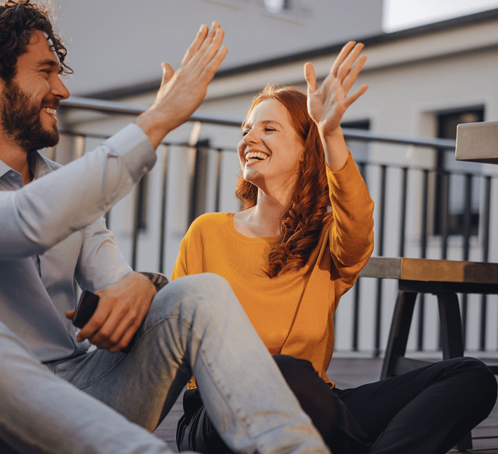 Man and woman are giving high five