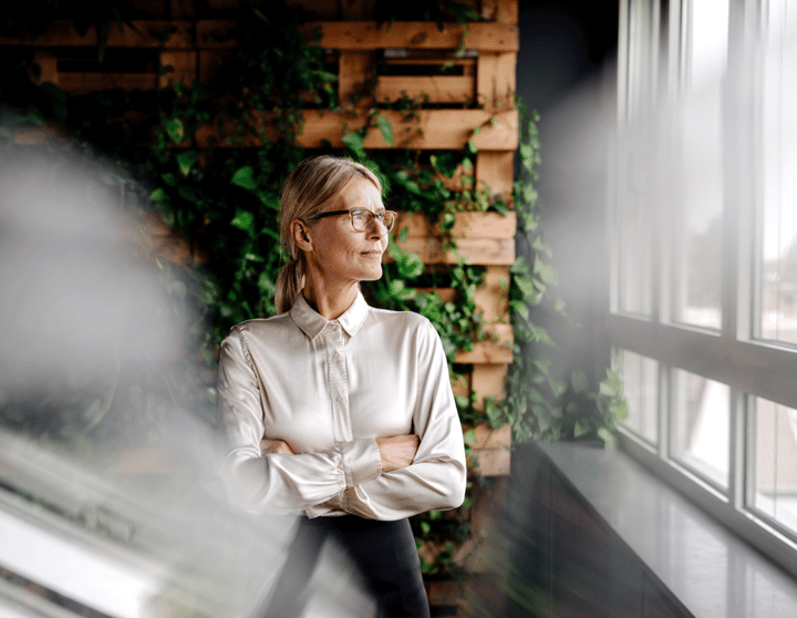 A woman looks out the window