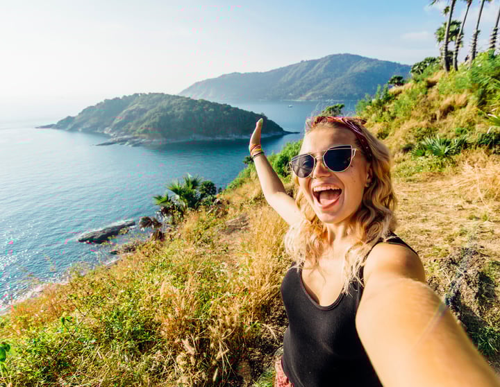 Women on holiday taking a selfie on a mountain