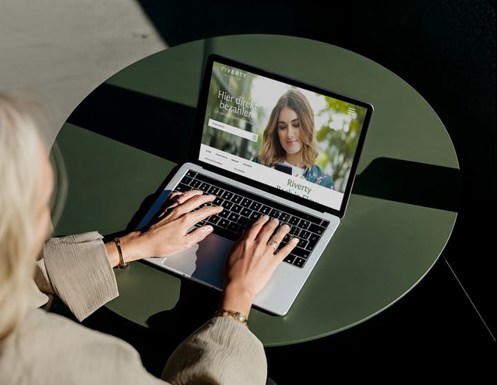 A woman works on a laptop.