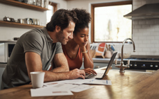 Couple looking at their budget on a computer screen