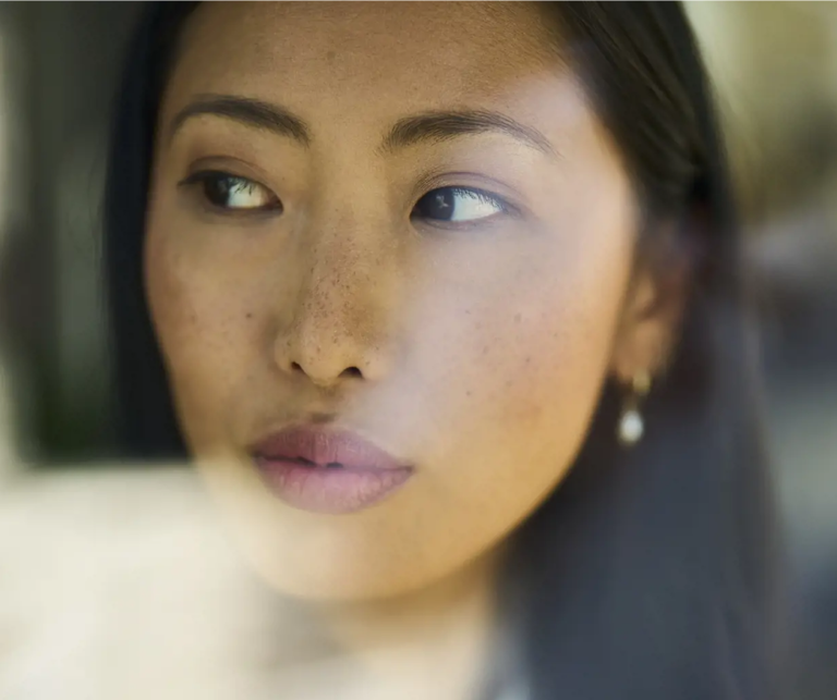 Image showing a woman looking through a window