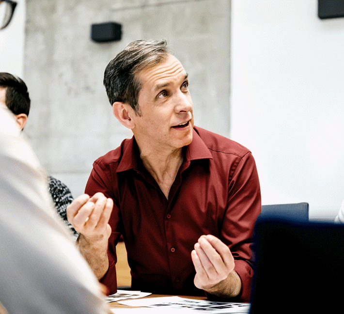 Man speaks in meeting