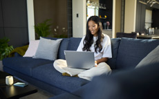 Woman reading on laptop