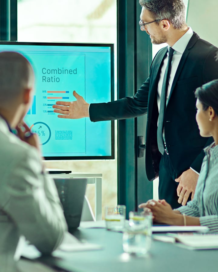 Employees in the office listening to a presentation